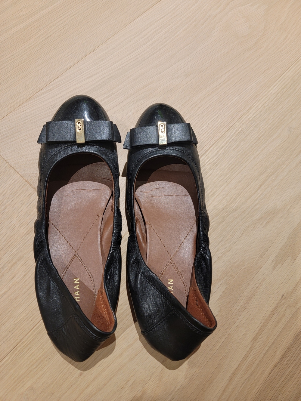 Cole Haan Black Leather Bow-Trim Ballet Flats with Gold Accent